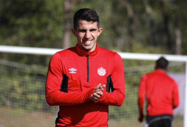 Luca smiling in a red Canada training top.